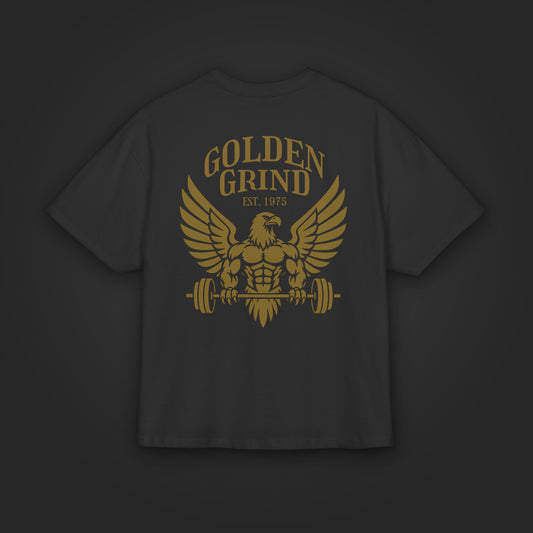 Golden Grind Eagle Oversized Tee in Schwarz, flach liegend mit goldenem Adler-Print